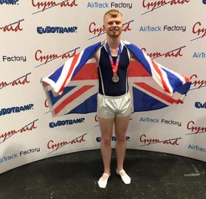 Ashley Reed posing with his silver medal at NDP Finals